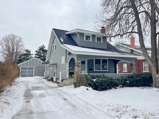 view of front of home with an outbuilding and a garage