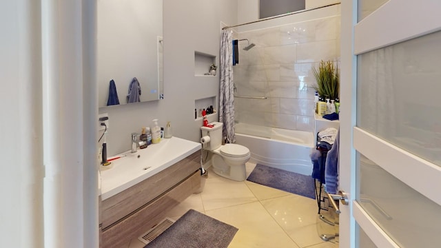 full bathroom with shower / bathtub combination with curtain, vanity, tile patterned flooring, and toilet