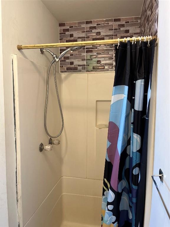 bathroom with a shower with curtain