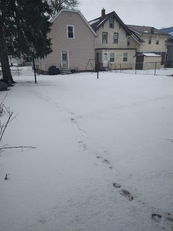 view of yard layered in snow