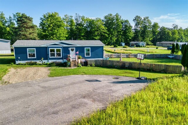 134 Primrose Ln, Edinboro, PA 16412 - manufactured / mobile home featuring view of scattered trees and roof with shingles