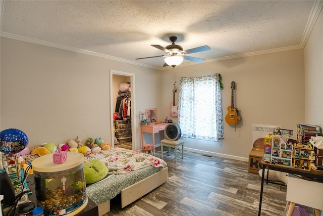 134 Primrose Ln, Edinboro, PA 16412 - bedroom with wood finished floors, a textured ceiling, crown molding, a spacious closet, and a closet