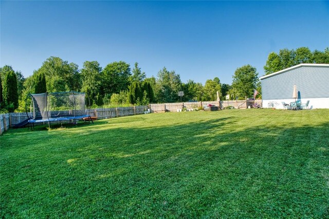 134 Primrose Ln, Edinboro, PA 16412 - fenced backyard featuring a trampoline