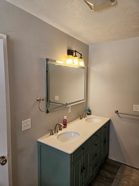 1925 N Mill St, North East, PA 16428 - full bath featuring double vanity, a textured ceiling, and a sink