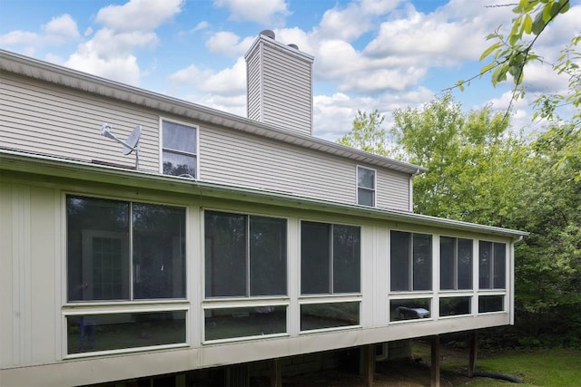 4119 Wood Hills Dr Unit C23, Erie, PA 16510 - back of property with a chimney and a sunroom