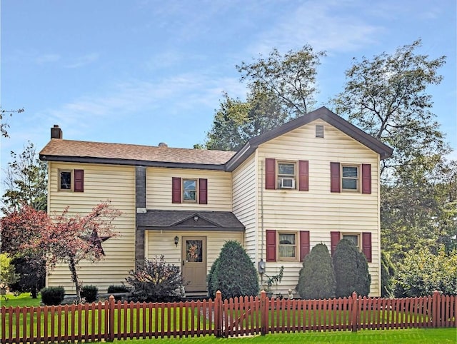 view of front facade with a front lawn