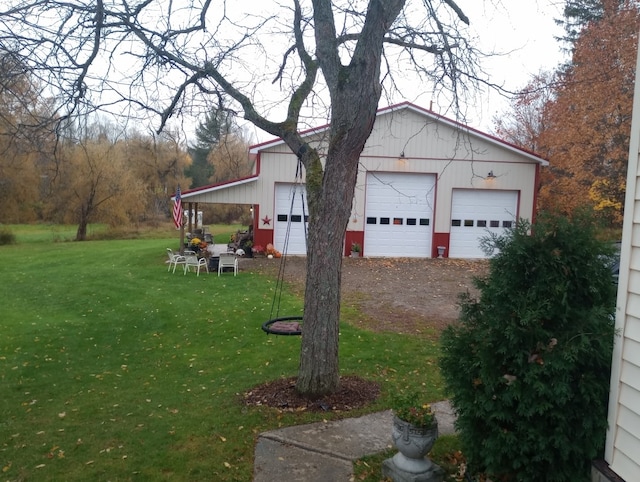 view of yard with a garage and an outdoor structure