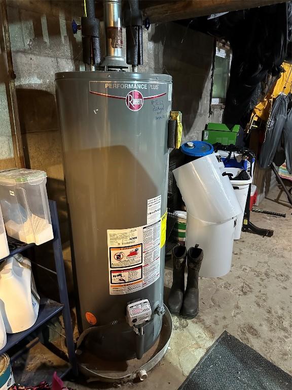 utility room featuring gas water heater