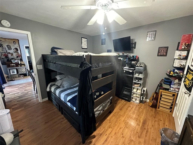 bedroom with ceiling fan and light hardwood / wood-style flooring