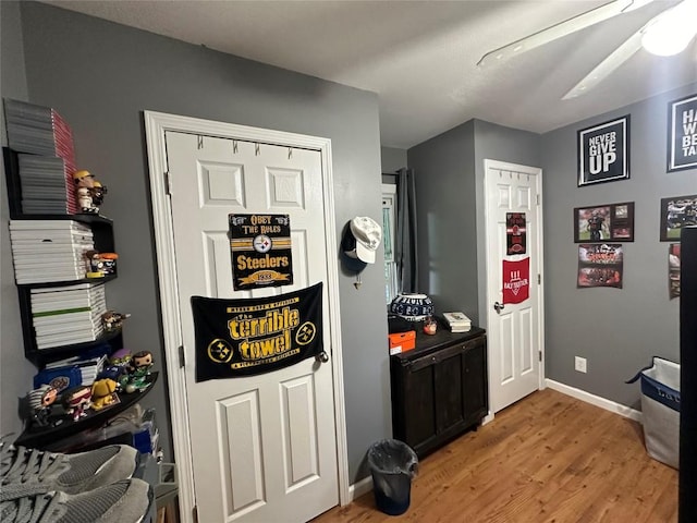 interior space featuring hardwood / wood-style floors and ceiling fan