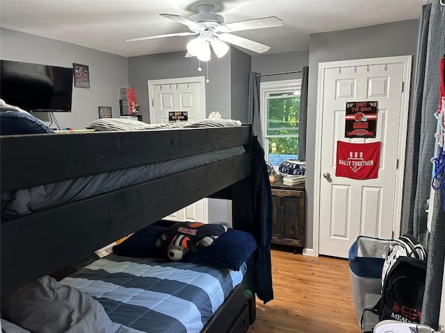 bedroom with hardwood / wood-style flooring and ceiling fan