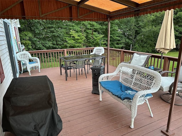 wooden terrace featuring grilling area