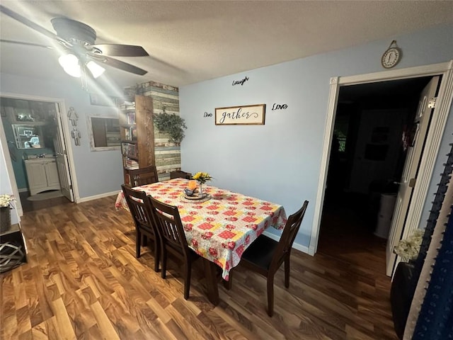 dining area with ceiling fan and hardwood / wood-style flooring