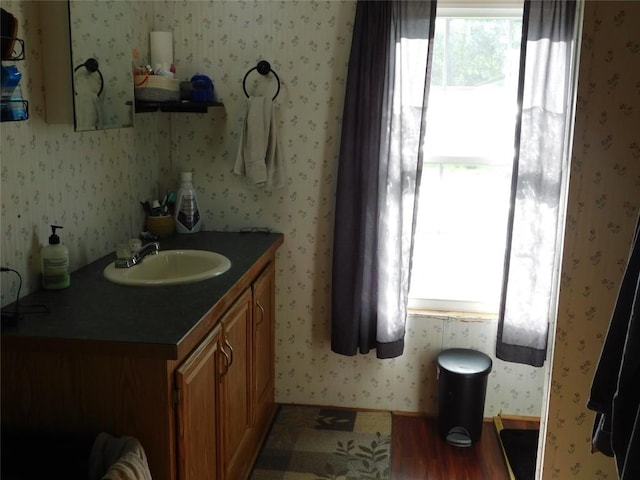 234 Shawnee Ave, Corry, PA 16407 - bathroom with healthy amount of natural light, vanity, and wallpapered walls