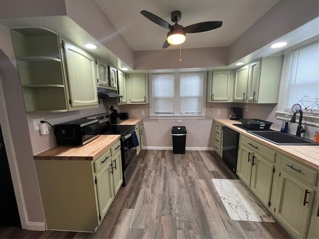 kitchen featuring black appliances, sink, green cabinetry, ceiling fan, and butcher block countertops