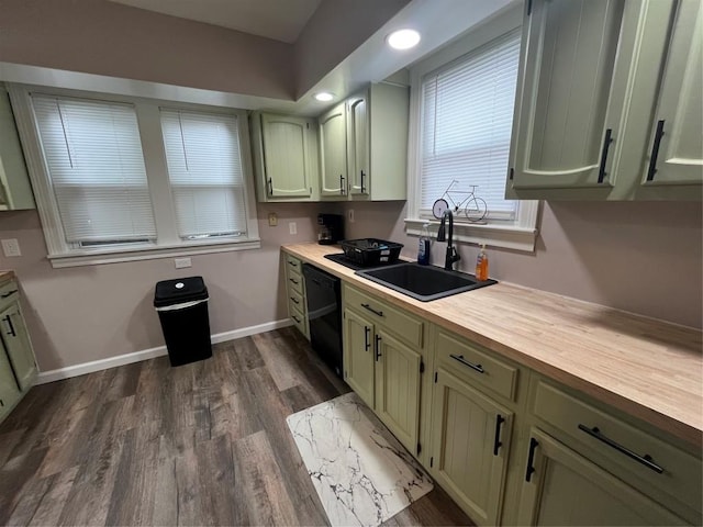 kitchen with wood counters, green cabinets, sink, black dishwasher, and dark hardwood / wood-style flooring