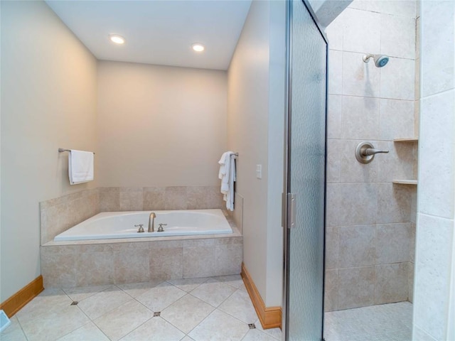 bathroom featuring tile patterned floors and shower with separate bathtub