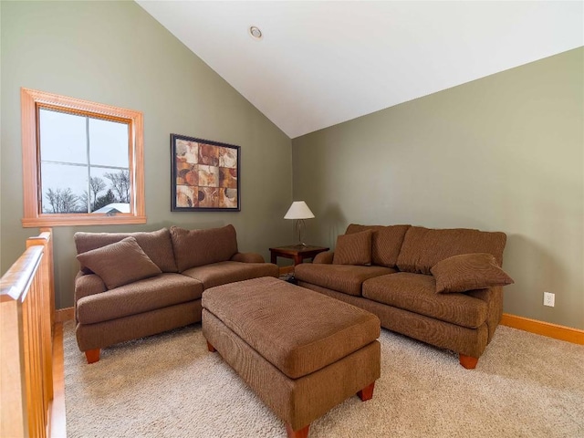 living room featuring lofted ceiling and light colored carpet