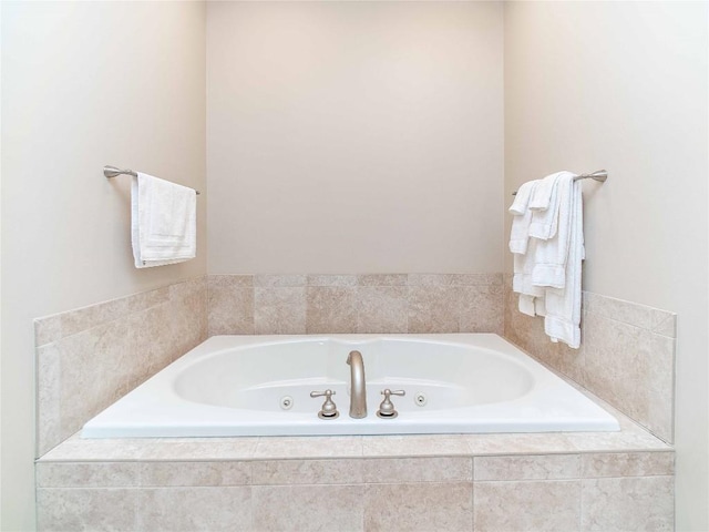 bathroom featuring a relaxing tiled tub