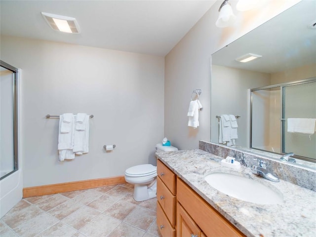 full bathroom featuring vanity, toilet, and combined bath / shower with glass door