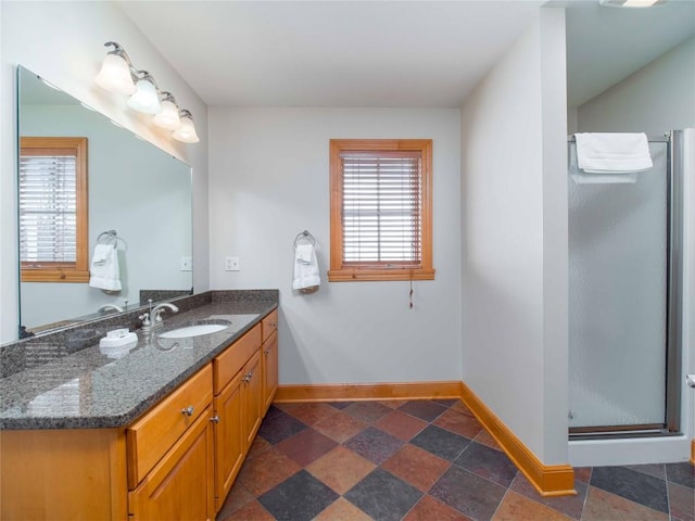 bathroom with vanity and an enclosed shower