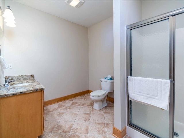 bathroom with vanity, an enclosed shower, tile patterned flooring, and toilet