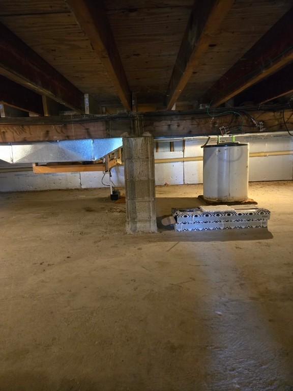 unfinished below grade area featuring gas water heater