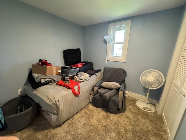 carpeted bedroom featuring baseboards