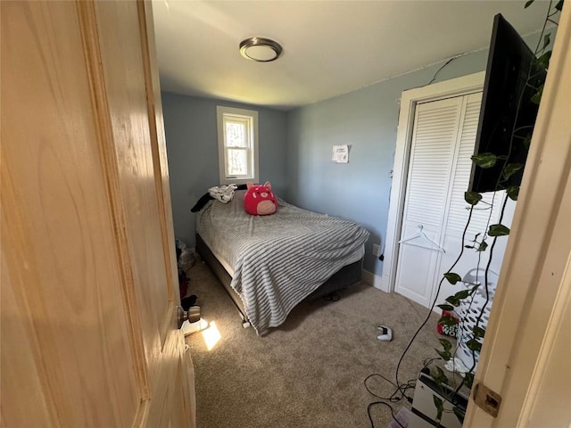 carpeted bedroom with baseboards