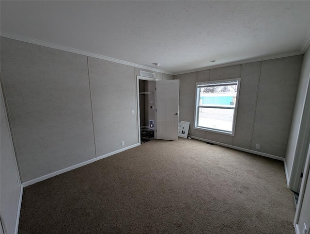 carpeted spare room with crown molding