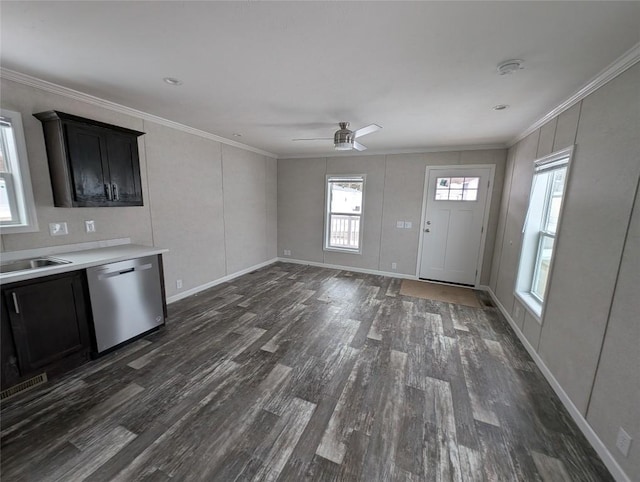 interior space with crown molding, ceiling fan, dark hardwood / wood-style flooring, and sink