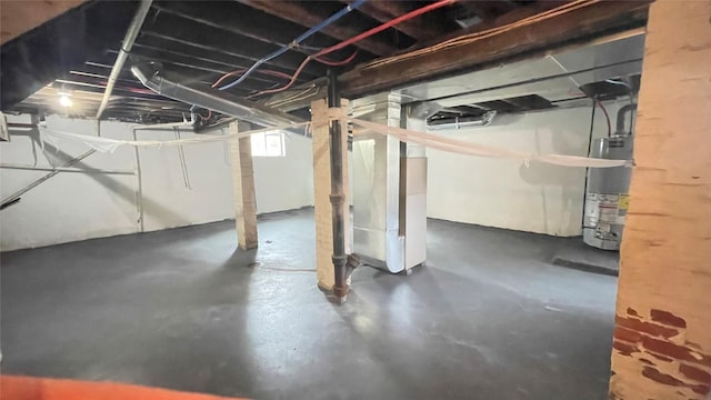 below grade area featuring heating unit and water heater