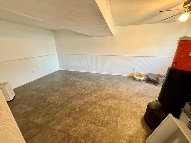 2735 W 35th St, Erie, PA 16506 - unfurnished living room featuring a ceiling fan and wainscoting