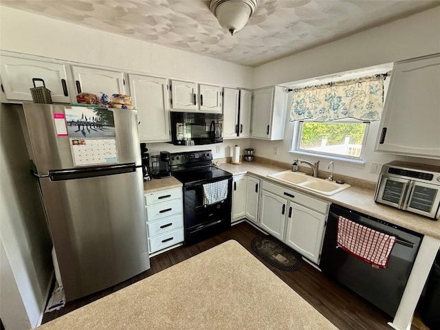 2735 W 35th St, Erie, PA 16506 - kitchen featuring black appliances, light countertops, white cabinetry, and dark wood-style flooring