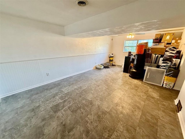 2735 W 35th St, Erie, PA 16506 - living area with wainscoting and a ceiling fan