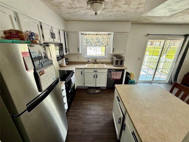 2735 W 35th St, Erie, PA 16506 - kitchen featuring black appliances, white cabinets, and healthy amount of natural light