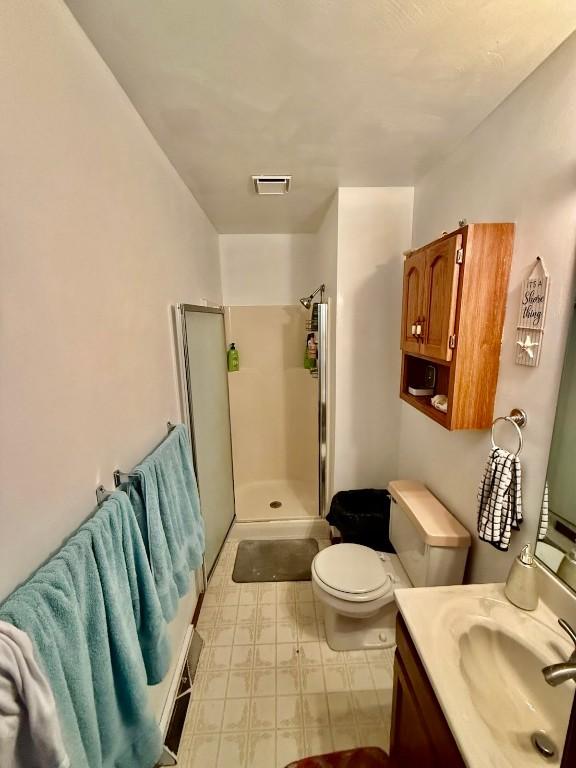 2735 W 35th St, Erie, PA 16506 - full bathroom featuring vanity, a shower stall, and tile patterned floors