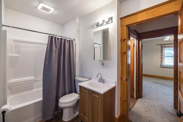 full bathroom featuring vanity, shower / tub combo with curtain, and toilet