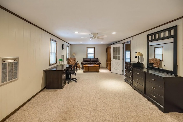 carpeted office space with heating unit, crown molding, and ceiling fan