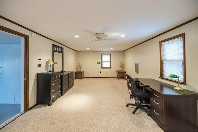 office area with ornamental molding, light colored carpet, and ceiling fan