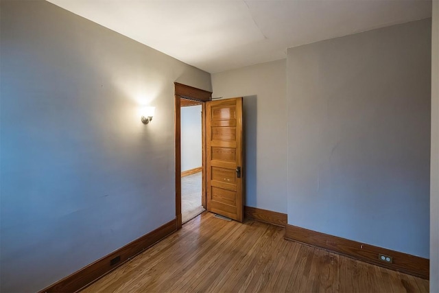 empty room featuring hardwood / wood-style flooring