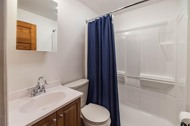 bathroom featuring vanity, toilet, and a shower with shower curtain