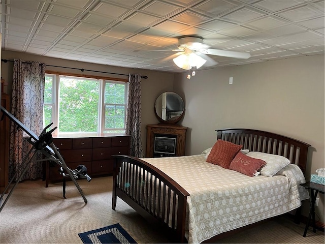 bedroom with ceiling fan and light carpet