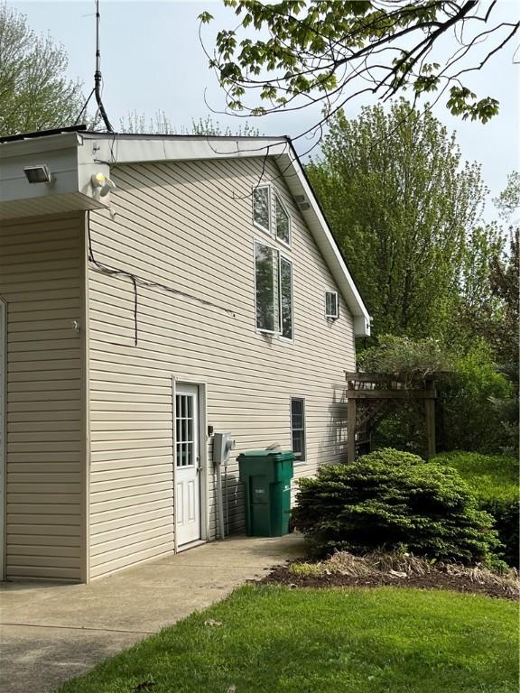 view of side of property with a yard