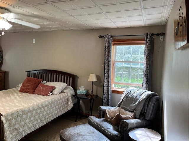 bedroom featuring carpet flooring, multiple windows, and ceiling fan