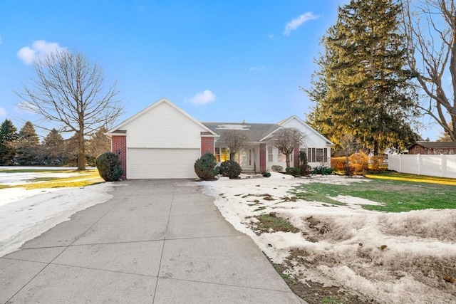 view of front of home featuring a garage and a front lawn