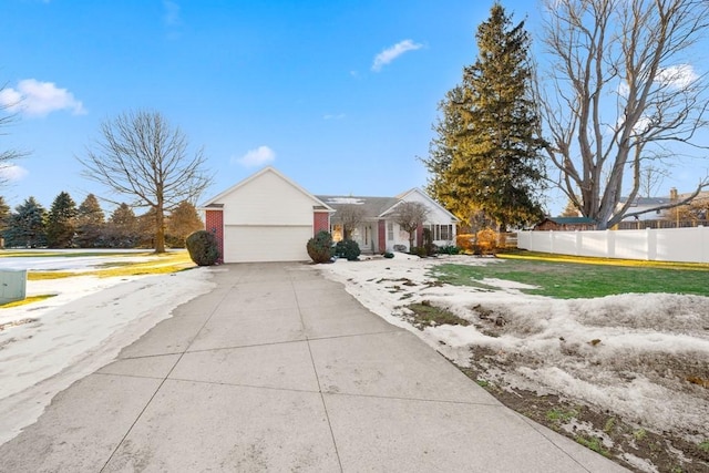 single story home with a garage and a front yard