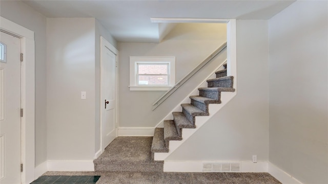 view of carpeted entrance foyer