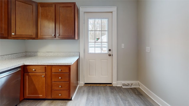 doorway to outside with light hardwood / wood-style flooring