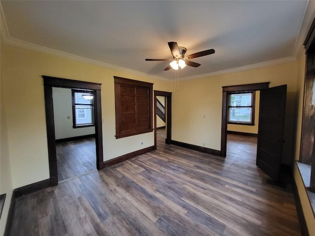 1038 Liberty St, Meadville City, PA 16335 - empty room featuring healthy amount of natural light, dark wood-style flooring, ceiling fan, crown molding, and baseboards